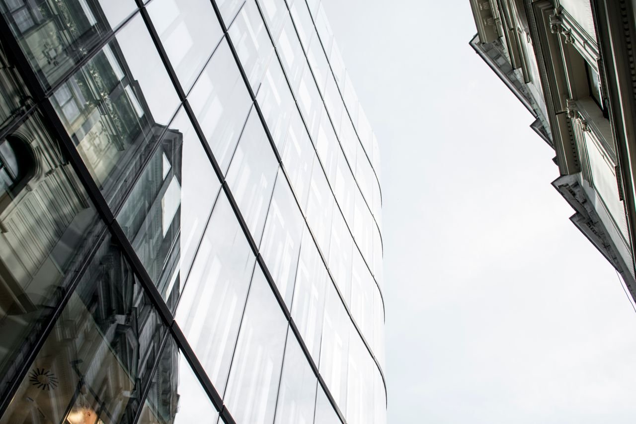 The Art of Drawing Readers In: Your attractive post title goes here Low angle view of modern glass buildings reflecting the cityscape in Prague.