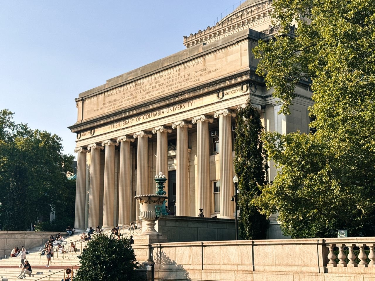 services-01 Historic Columbia University Library in a sunny outdoor setting.